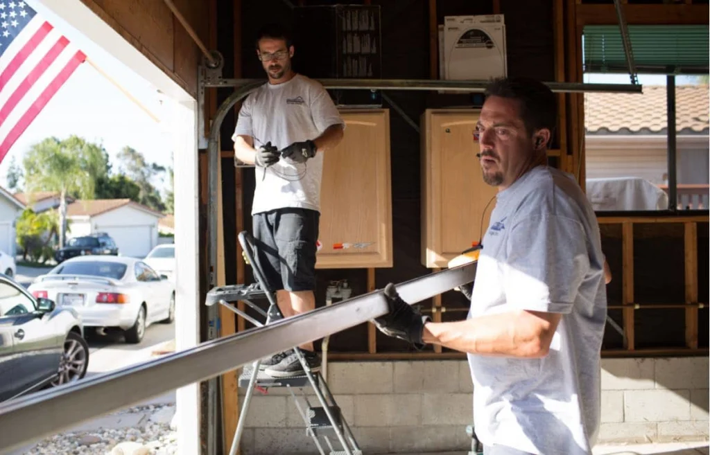 Bradbury garage door repair techs fixing garage door frame