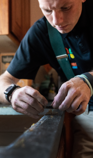 Handyman fixing a piece of furniture.